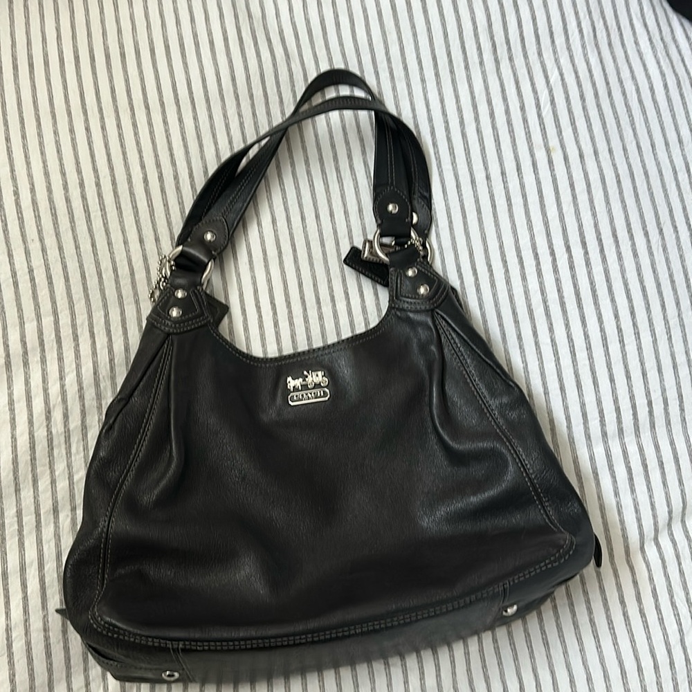 NWOT- Black Coach shoulder bag. Never used. Perfect condition.